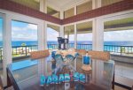 The dining room table comfortably seats 6 and offers breathtaking ocean views